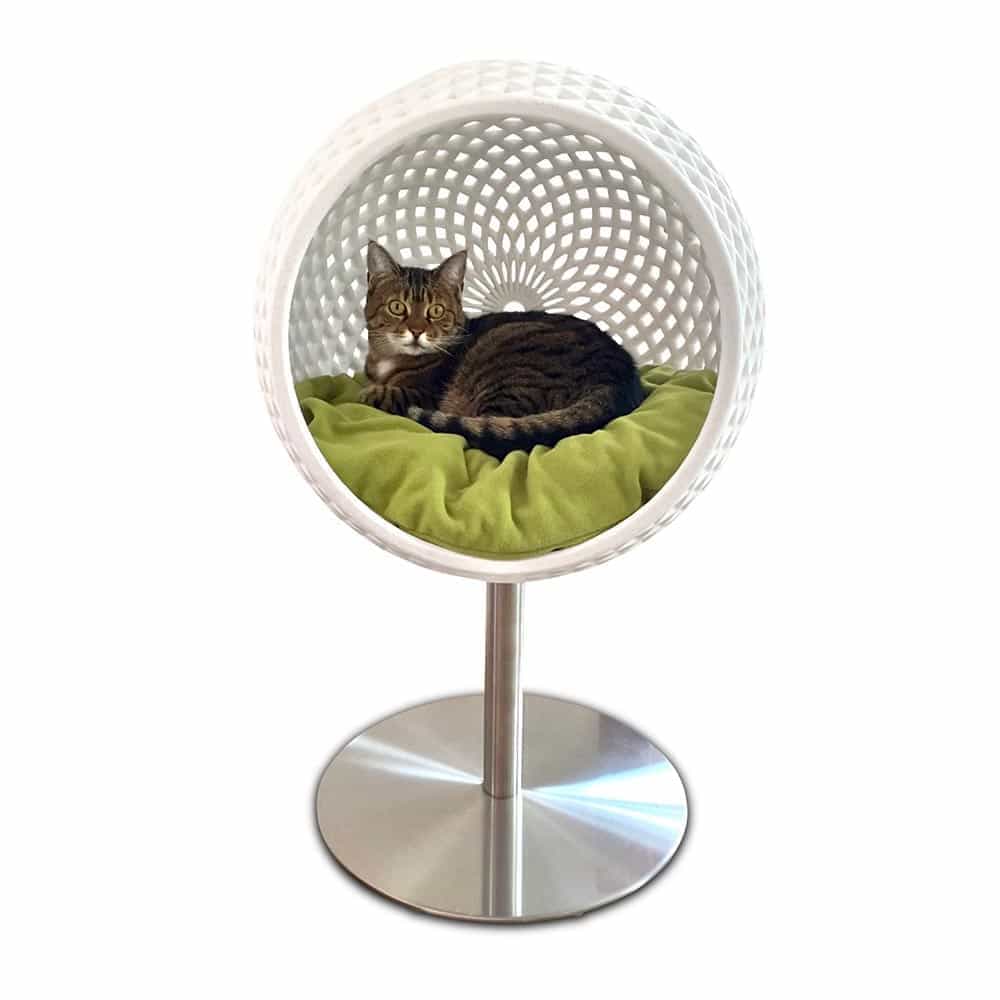 Cat lady Giselle snuggles up in the 3D printed Cocoon cat bed by pet-interiors.